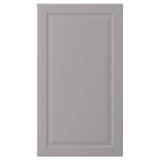 A grey BODBYN cabinet door with a smooth, bevelled panel design in fibreboard.