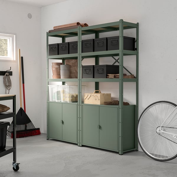 BROR green storage system with shelves and cabinets near wall.