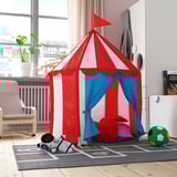 Red & blue childs play tent, CIRKUSTÄLT, in living room. Bright colors, soft materials. Larger than toy, smaller than chair.
