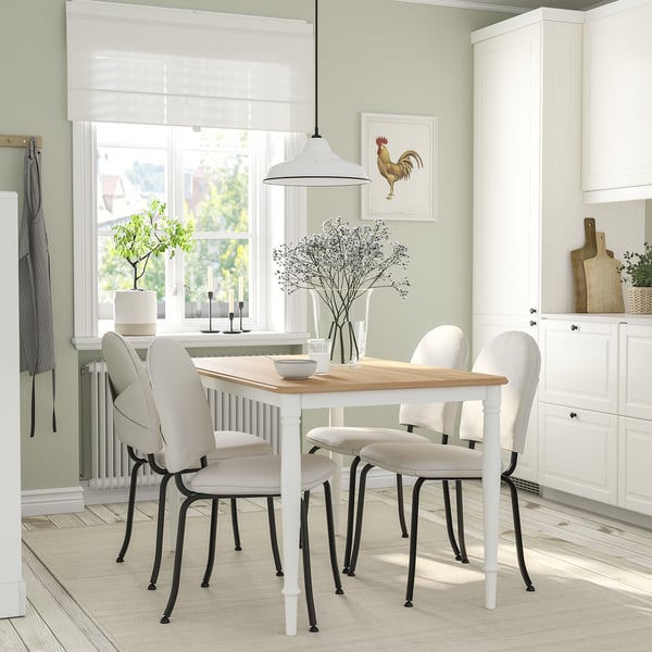 Bright dining area with DANDERYD 4-seat set, pendant lamp, and flowers.