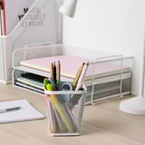 DRÖNJÖNS mesh pencil holder with utensils on wooden desk.