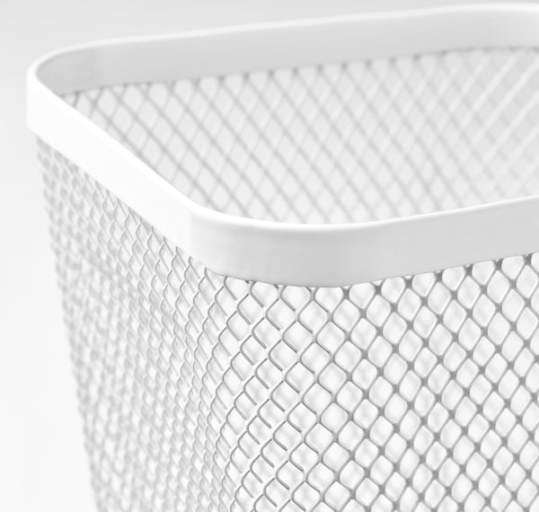 Close-up of white mesh storage basket, showcasing its textured diamond pattern and smooth rim.