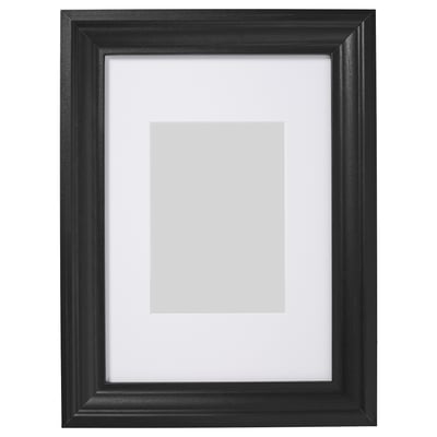 Black picture frame with white mat, rectangular, traditional design.