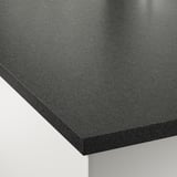 Dark, smooth countertop edge; seamless, polished surface; sleek design.