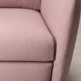 Soft, round EKOLSUND recliner in light grey fabric, showcasing plush cushions and clean lines.