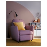 Relax in the cozy purple EKOLSUND recliner with a yellow cushion, perfect for small spaces. Adjustable backrests and soft rounded shapes.