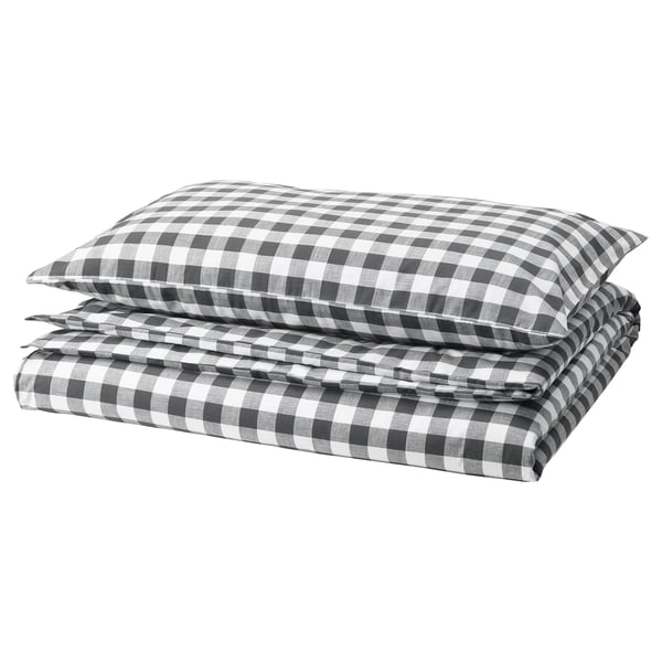 EKTANDVINGE bedding set featuring black & white checkered design, folded neatly. Made from organic cotton.