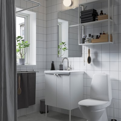 Modern bathroom with ENHET storage. Sleek design, open/closed storage, shelves for towels and toiletries, wedge dowel, no-drill vanity unit.
