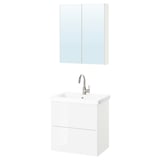 Modern white bathroom setup. Includes wall-mount vanity with two drawers and silver faucet, topped with a mirrored medicine cabinet.