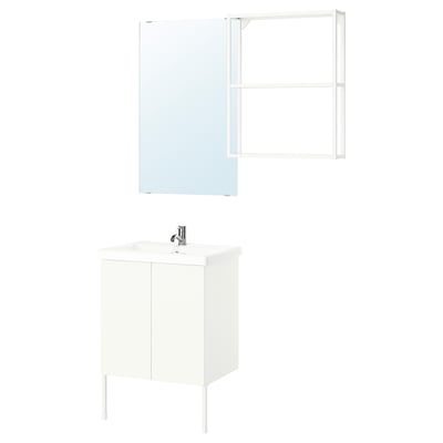 Modern white bathroom vanity with mirror and wall shelf.