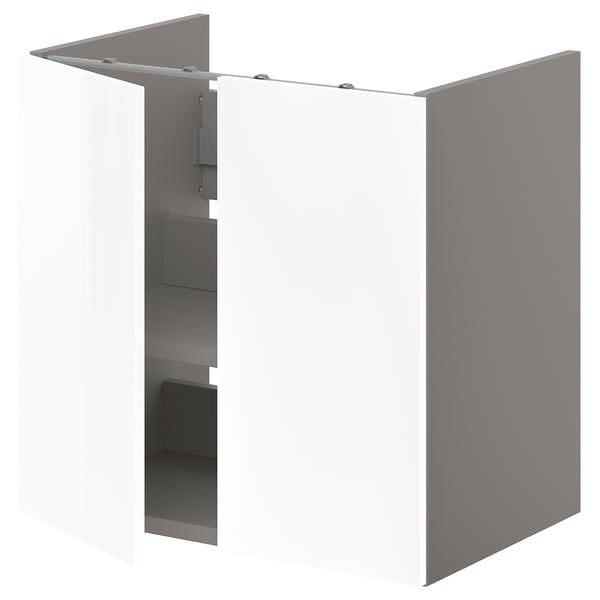 A white ENHET base cabinet for a washbasin with shelves. It glossy white doors, sleek design, and offers storage space for towels and toiletries.