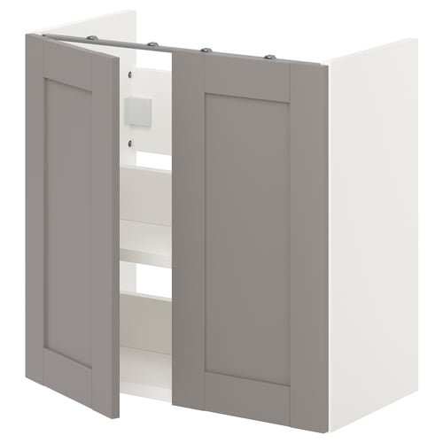A grey ikea ENHET bathroom wall cabinet with two doors. It has a modern design and is wall-mounted. The cabinet two shelves inside.