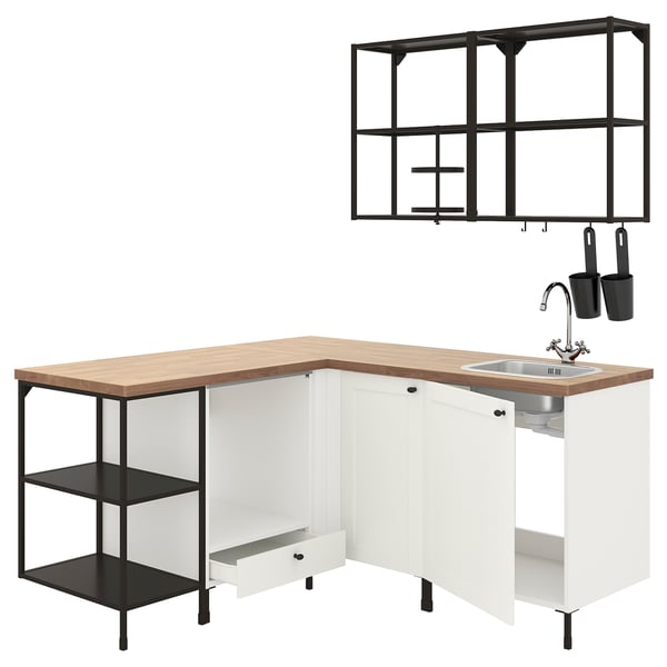 Modern white l-shaped kitchen setup with wooden top, black metal accents, open shelves, and sink.
