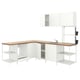 Modern white kitchen setup with wood counter, open shelves, and built-in sink.