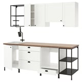 Modern white kitchen setup with wooden countertop, black accents, and open storage; sleek and functional design.