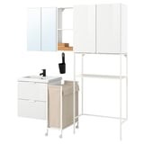 Modern white bathroom setup with sink, storage, mirror, and laundry bag.