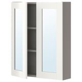 A white ikea ENHET wall cabinet with a mirror door and two shelves for bathroom storage.