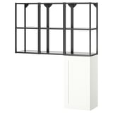 An ENHET storage unit, white with black metal accents, featuring open and closed compartments.
