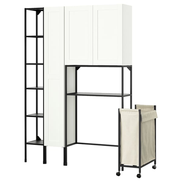Modern ENHET storage system: white cabinet, black metal frames, shelves, and beige laundry bag on wheels.