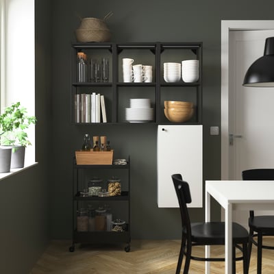 Dark ENHET kitchen storage unit with shelves and cabinet for dishes and glasses.