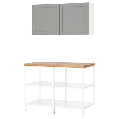 This image shows an ikea ENHET kitchen setup with a grey wall cabinet and a white open shelf unit with a wooden top.