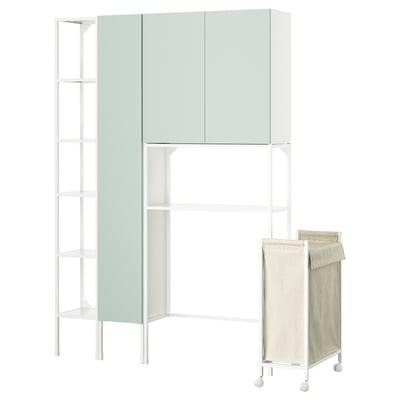 A white ENHET storage unit with light green cabinets, an open metal shelf, and a beige laundry bag on wheels.