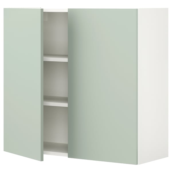 Light green ENHET wall cabinet with 2 shelves, modern & minimalist design, pale grey-green color.