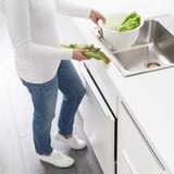 Preparing lettuce in kitchen