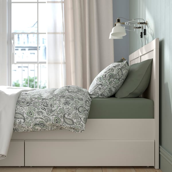 Bed with storage drawers, adjustable slats, white frame, wall lamp