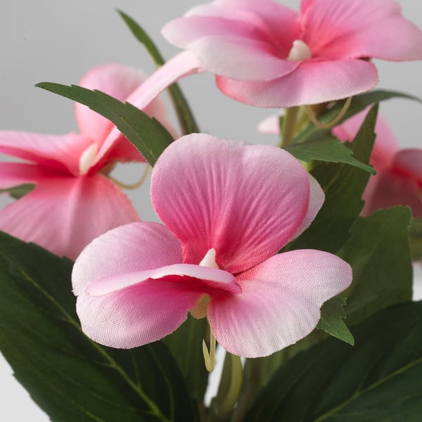 Lifelike pink flowers, detailed & vibrant. Crafted from recycled materials. Our doorstep.