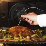 Cooking meal with integrated meat probe in oven.