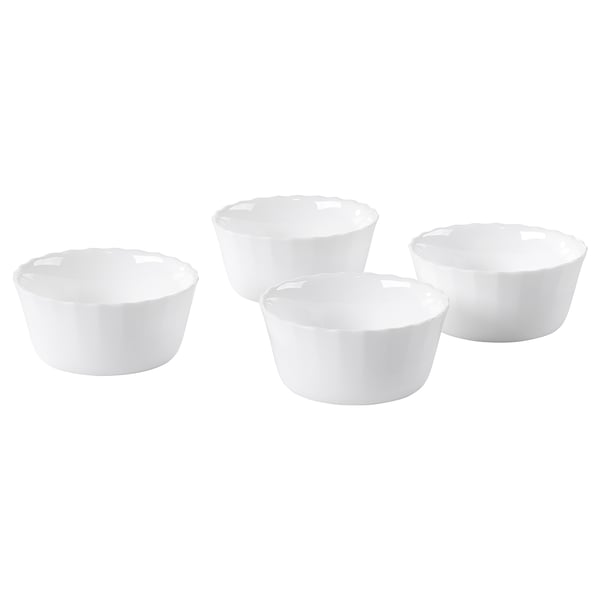 Four white round bowls, made of tempered opal glass, arranged on a white background.