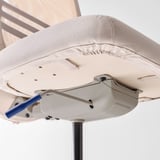 Ergonomic office chair detail: sturdy base, smooth castors, breathable mesh.