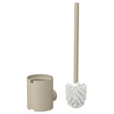 Beige FLORSJÖN toilet brush holder and brush. Cylindrical holder, long-handled brush with white bristles. Made of plastic and metal for bathroom use.