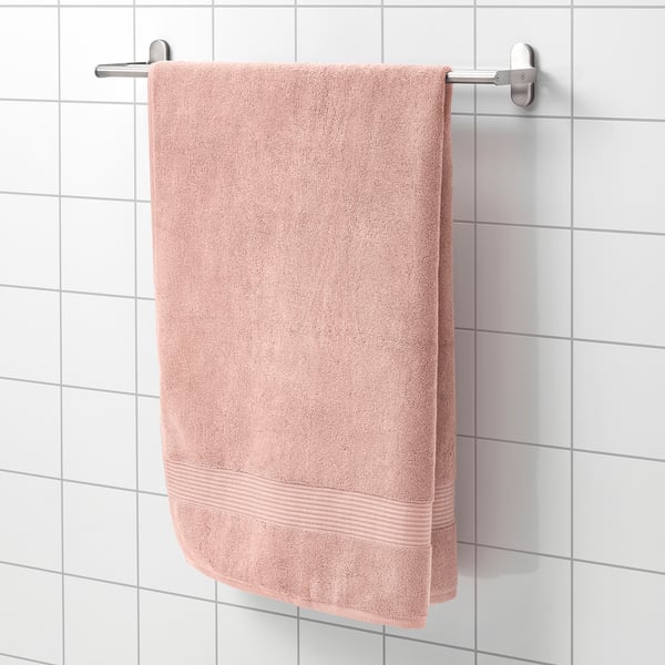 A FREDRIKSJÖN towel on silver rack, light pink, cotton, absorbent with woven border.