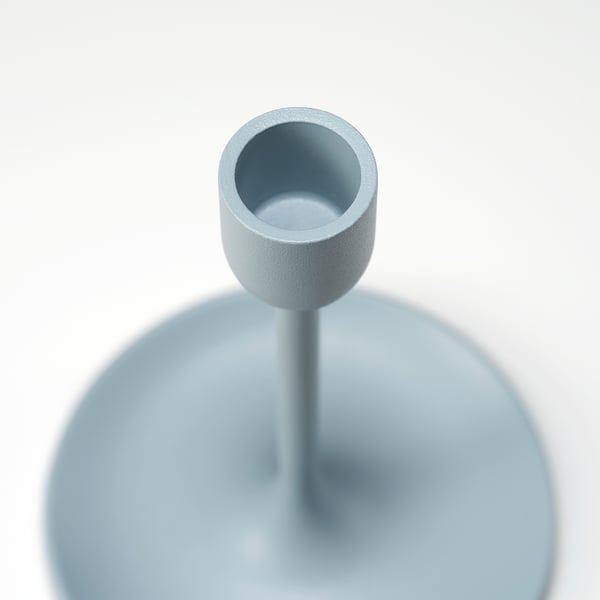 Modern light blue candlestick with sleek design and textured finish, ensuring durability and aesthetic appeal.