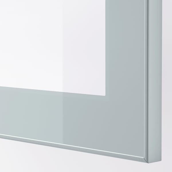 Close-up of sleek, modern, light grey-blue glass door frame; modern design, reflective surface.