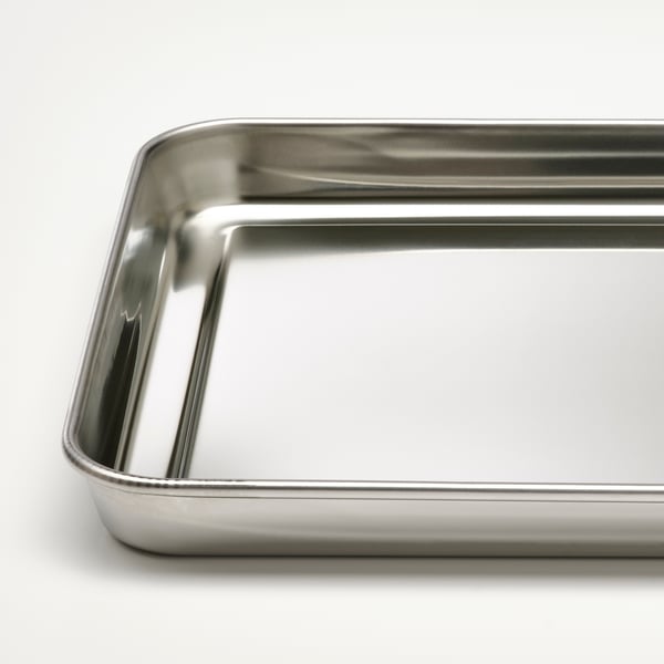 Stainless steel tray, shiny and clean, high quality, rectangular shape.