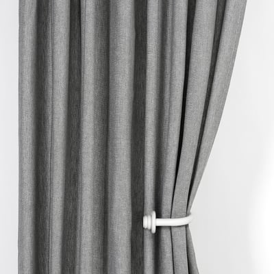 Black striped curtains tied back with white holders, allowing light through.