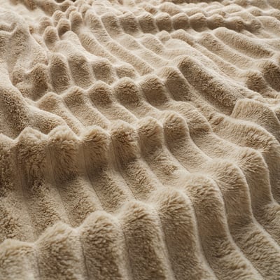GULLSTRÅLE: light beige recycled polyester blanket with soft, horizontal stripes folded neatly.