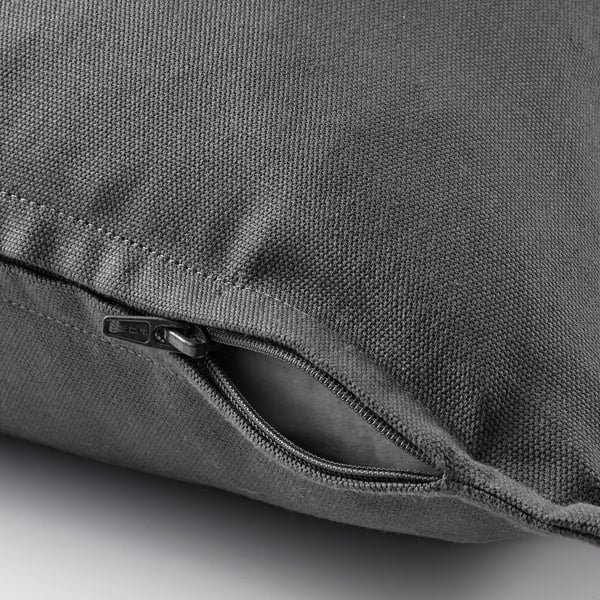 Close-up of gray cushion cover with hidden zipper, showing easy removal.
