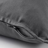Close-up of gray cushion cover with hidden zipper, showing easy removal.
