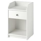 A white HAUGA bedside table with a single drawer and open shelves, suitable for a modern bedroom setup.