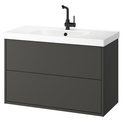 Modern grey bathroom vanity, white sink, black faucet.