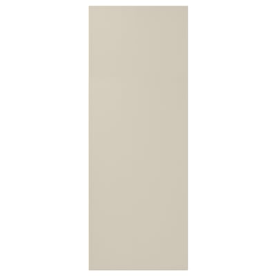 Beige HAVSTORP cabinet door, smooth fiberboard, rectangular.