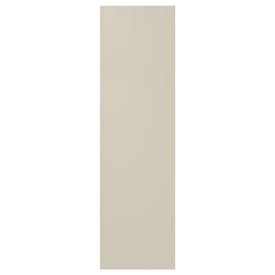 A beige HAVSTORP cabinet door with a smooth, modern design made of acrylic paint and fiberboard.