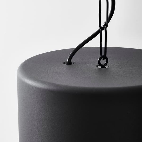 Modern, black, cylindrical lamp with sleek metal hanging chain; stylish and durable design.