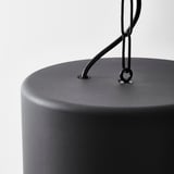 Modern, black, cylindrical lamp with sleek metal hanging chain; stylish and durable design.