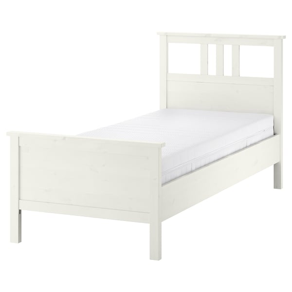 White HEMNES bed, solid pine, rectangular, simple design.