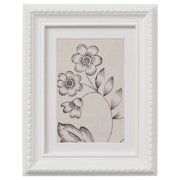 This describes a white framed picture with a black-and-white floral design.